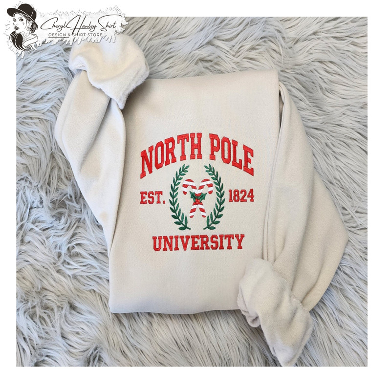 Embroidered North Pole University Sweatshirt - North Pole - Candy Canes - Funny Santa Unisex Crewneck Sweatshirt or Hooded Sweatshirt.jpg