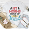 My Horns Hold Up My Halo Tee.png