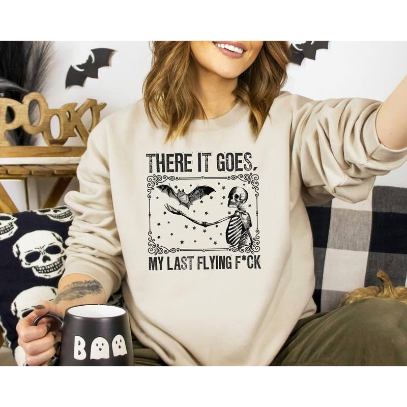There It Goes My Last Flying Fuck Sweatshirt, Halloween Sweatshirt, Halloween Skeleton Sweatshirt, Spooky Halloween Shirt, Halloween Gift.jpg