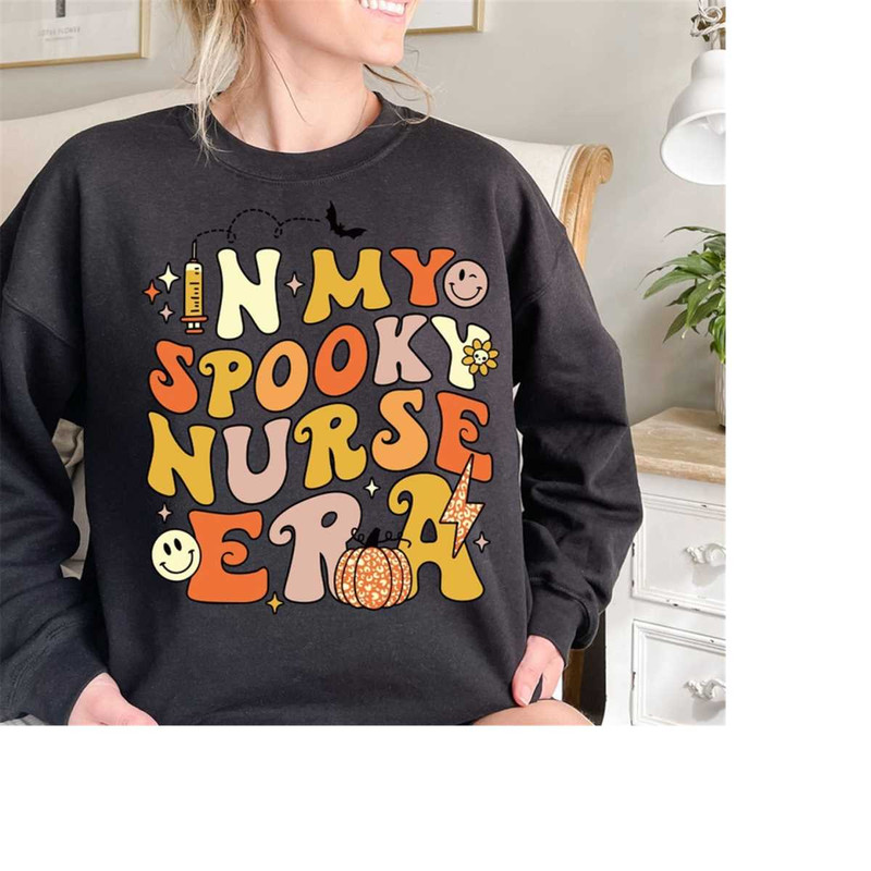 In My Spooky Nurse Era Halloween Spooky Nurse Sweatshirt, Fall Shirt, Halloween Outfits, Halloween Funny Hoodie, Sanders.jpg
