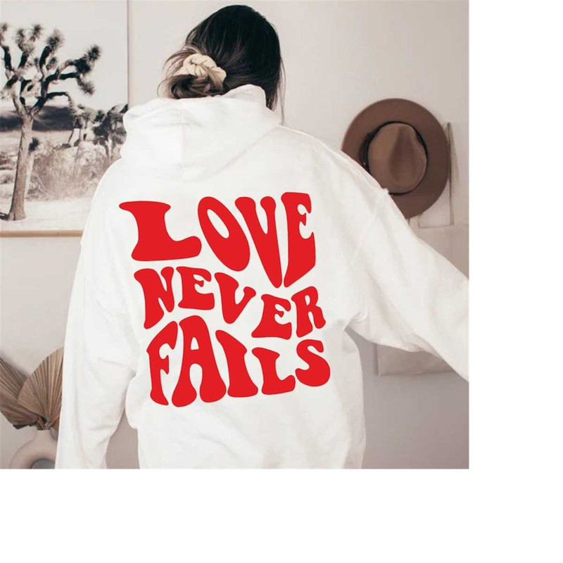 Love Never Fails Hoodie, Trendy Hoodie, Sayings on Back Trendy Hoodie, Positivity Quotes Hoodie, Bible Quotes Christian.jpg