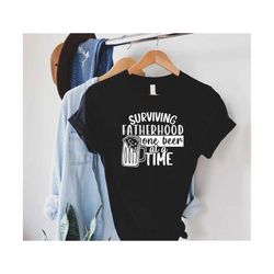 funny father shirt,fatherhood tshirt,fathers day gift,surviving fatherhood one beer at a time,best dad shirt,dad beer sh