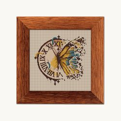 Clock with butterfly cross stitch pattern
