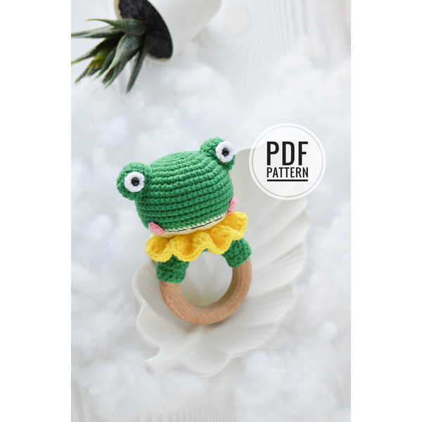 frog rattle on wooden ring.jpeg