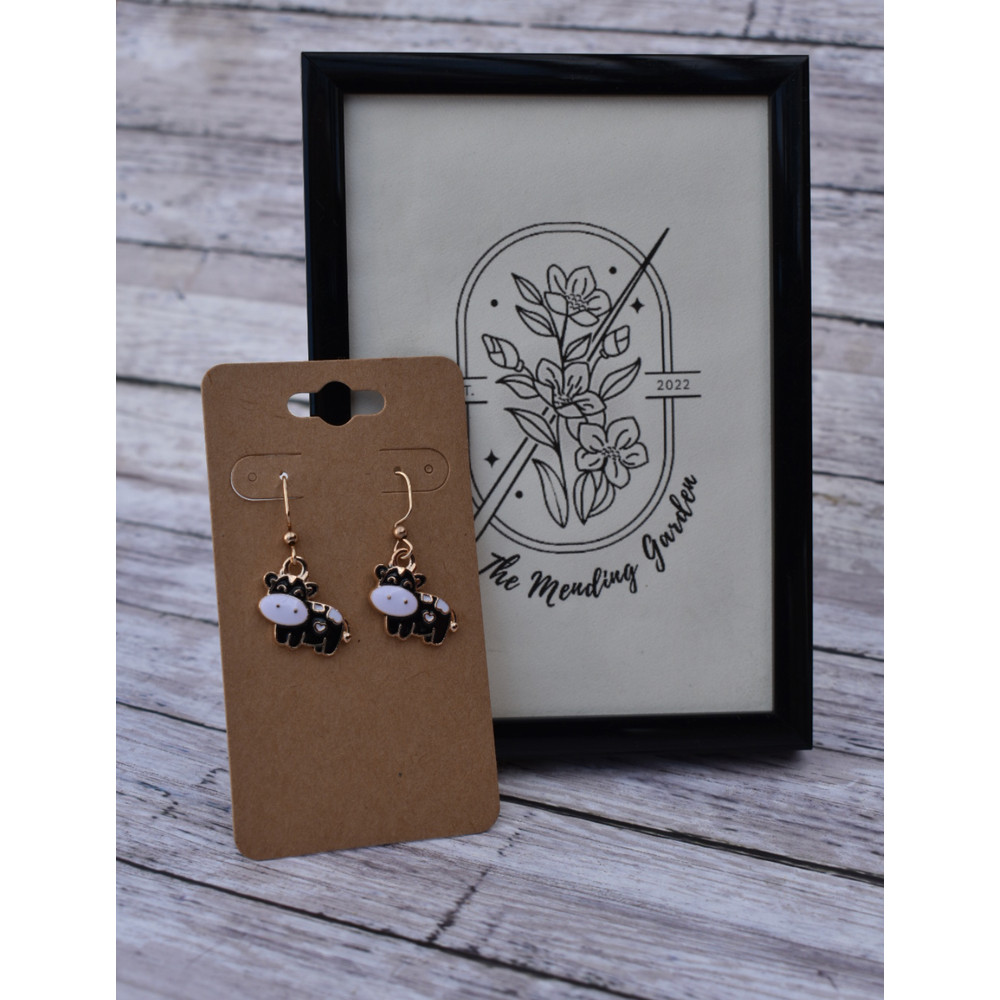 Cow Earrings with logo.png