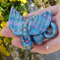baby-dragon-sculpture-labradorite-style-polymer-clay-needle-minder-for-cross-stitch-figurine-dragon-by-annealart (1).png