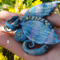 baby-dragon-sculpture-labradorite-style-polymer-clay-needle-minder-for-cross-stitch-figurine-dragon-by-annealart (2).png