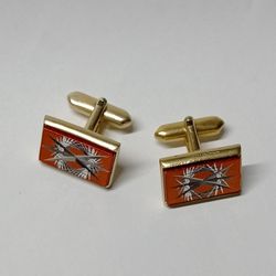 vintage cufflinks with a red insert