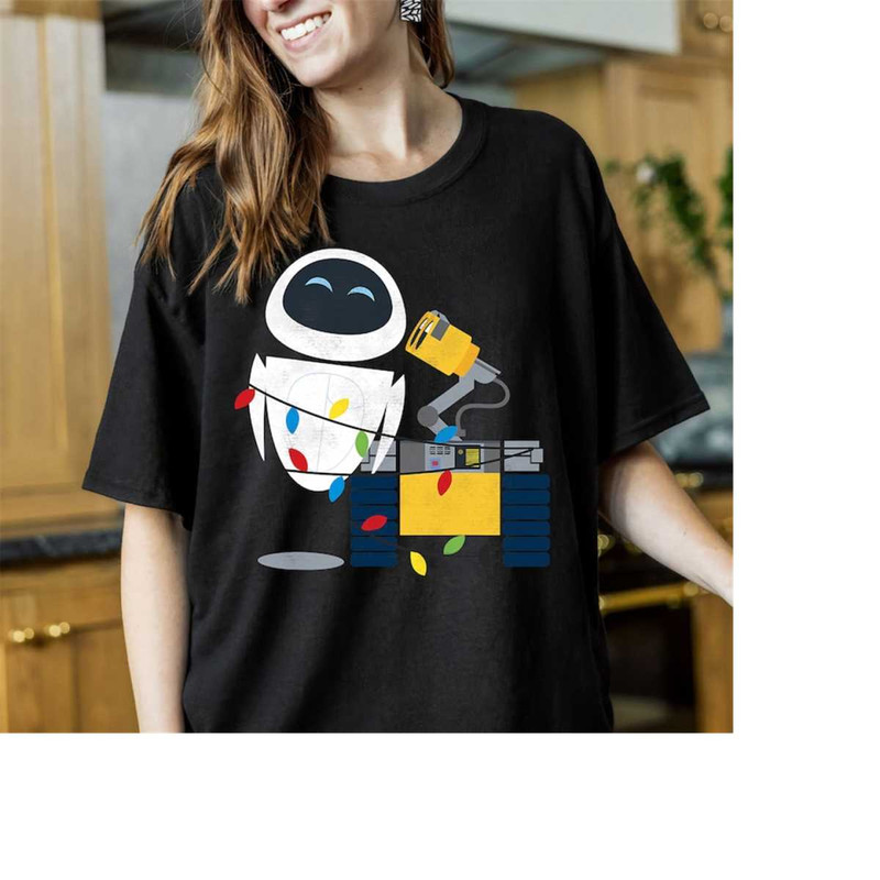 Disney Wall-E and Eve Christmas Light Wrap Holiday Gifts Shirt, Disneyland Christmas Family Matching Tee, Christmas 2023.jpg