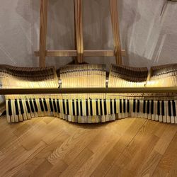 Wall lighted decor made from the keys of a 1915 vintage Petrof piano keys