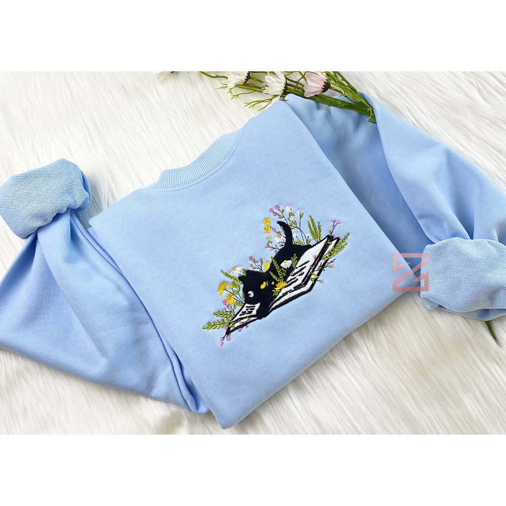 Cute Cat Lying On Book With Flower Embroidered Sweatshirt Flower With Cat Embroidered Hoodie Book Lover T-shirt Crew Neck Sweatshirt.jpg