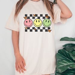 checkered pattern smiley face shirt, retro smile shirt, trendy smile face shirt, happy face graphic, butterfly smiley s