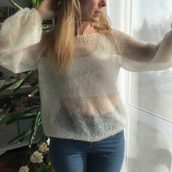 Knitted angora sweater is light and warm