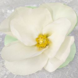 Artificial cloth champagne magnolia flower. Satin ribbon fabric flower for clothing. Sewing embellishment for dress