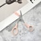 Stainless steel pink eyebrow trimming scissors with built-in comb for precise grooming and perfect eyebrows