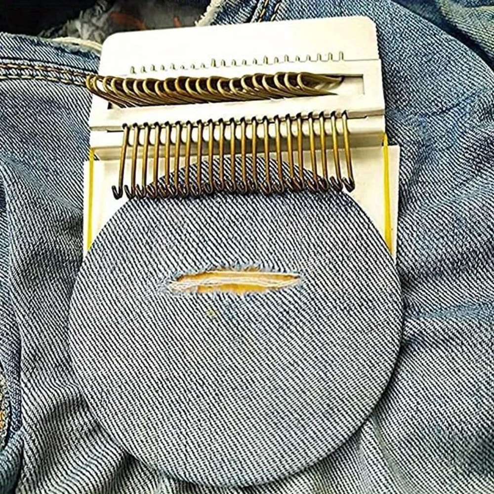 closeup of fabric on wooden darning tool