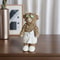 Whimsical Home Desktop Decoration, Highland Cow Wearing a Bathrobe with Eyes Sticking to a Cucumber Statue