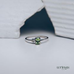 Oval Green Peridot Dainty Silver Dainty Engagement Ring with Simulated Diamond Cubic Zirconia in Side Heart