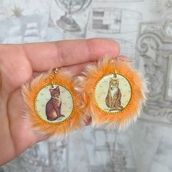 Cute handmade earrings. Image of cats, fur trim.