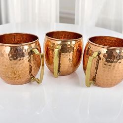 handmade hammered copper mugs with unlacquered finish and brass handle - artisan drinkware