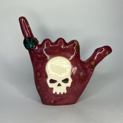 handmade ceramic bubbler Hand with a skull