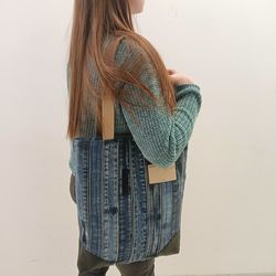 Stylish denim shopper made of denim belts with pockets inside- decorated with leather