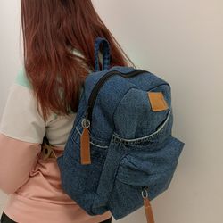 denim backpack with 100 percent cotton lining, handmade, jeans recycling, 3 pockets outside, 1 deep pocket and 1 zipped