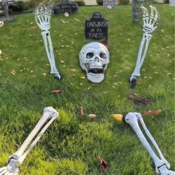 spooky yard garden halloween decoration, realistic skeleton arm leg bones, halloween skeleton stake decorations