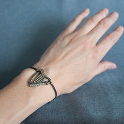 Celtic Harp bracelet on cotton cord. Female jewelry