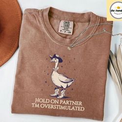 hold on partner im overstimulated comfort colors tee, cowboy duck shirt unhinged tshirt, cowboy frog shirt, wierdcore