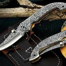 custom hand made d2 steel engraved folding knife..