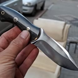 artisan camping knife with compact black handle & fixed blade design