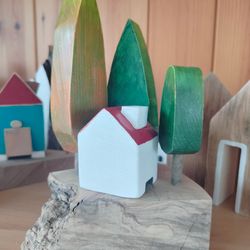 miniature wooden incense house and trees
