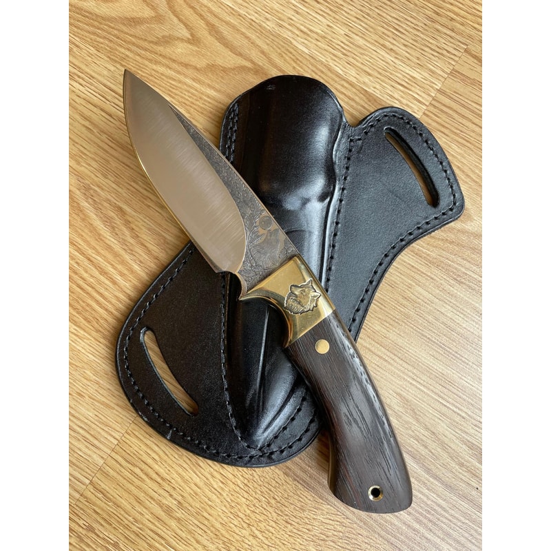Premium Hunting Knife With Wolf Engraved Blade Ebony Handle Brass Bolsters 1