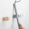 Wall Mounted Broom & Mop Holder Rack Seamless Storage Organizer