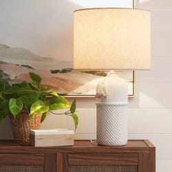 large white ceramic table lamp, assembled and elegant, soft lighting, modern home decor, threshold