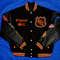Vintage hockey letterman jacket with orange sleeve design and retro NHL branding
