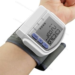 digital wrist blood pressure monitor with heartbeat and pulse rate display