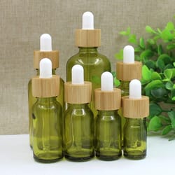 olive green glass dropper bottle – refillable travel container for essential oils and cosmetics