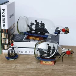 black pearl ship-in-a-bottle – pirates of the caribbean drifting vessel for modern executive desks & nautical home decor