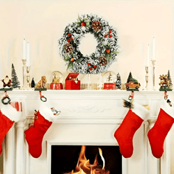 classic christmas wreath with red berries and mushrooms
