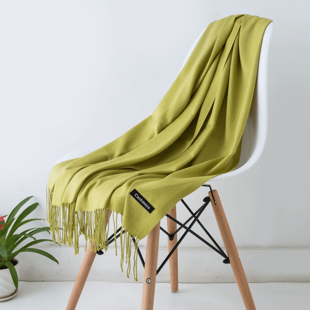 Neutral tone scarf draped on coat