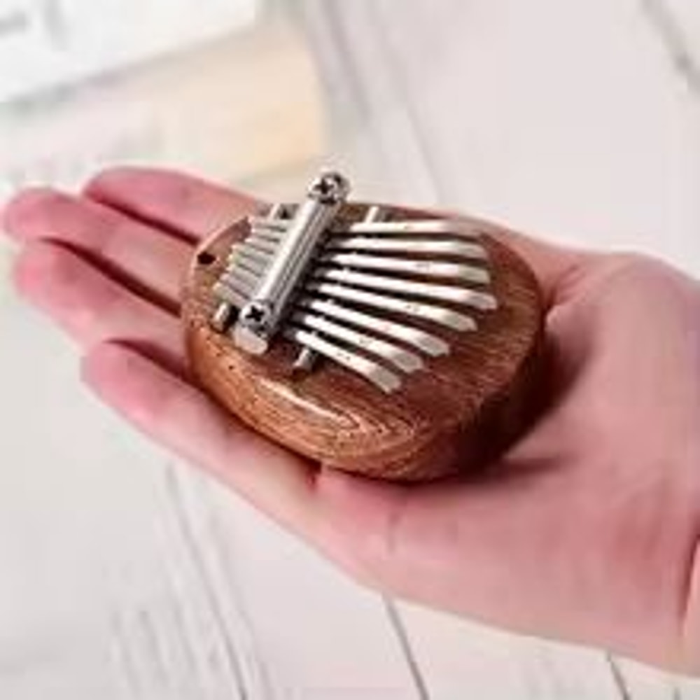 8Key Mini Kalimba Thumb Piano Water Drop Portable Musical Instrument 0