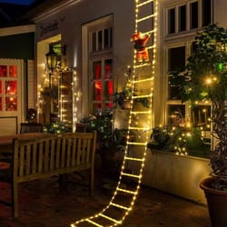 santa claus climbing ladder christmas decoration with warm lights for indoor and outdoor holiday display