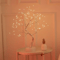 Fairy Light Tree Lamp glowing in a peaceful bedroom setting