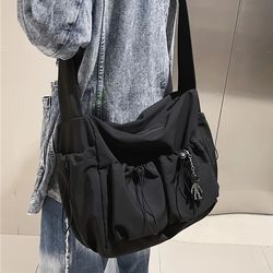 spacious crossbody bag, stylish drawstring accent, secure zipper closure, fashionable bag