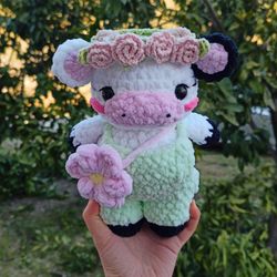 handmade crochet cow plush with floral crown, green overalls & flower bag – cute amigurumi gift
