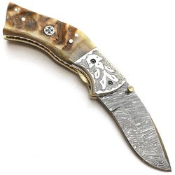 handmade damascus folding pocket knife with leather sheath ram horn handle and custom forged bolster
