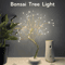 Spirit tree LED lamp on bedside table