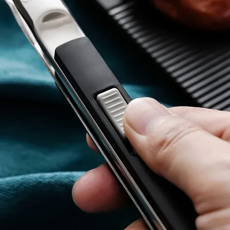 spatula tongs lifting burger from pan without slipping